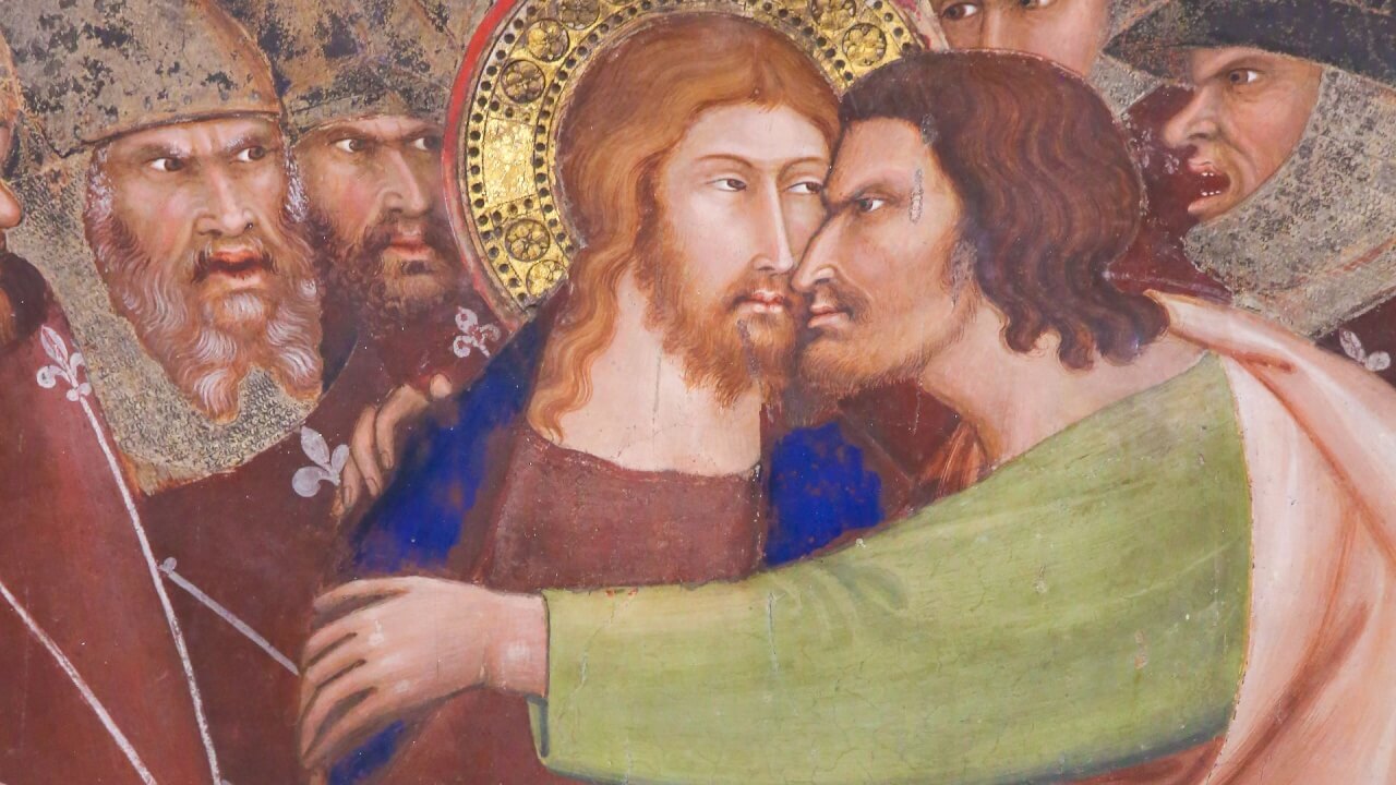 Pintura de Judas traindo Jesus com um beijo.